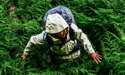 A woman wearing an OutDry Extreme Eco jacket. 